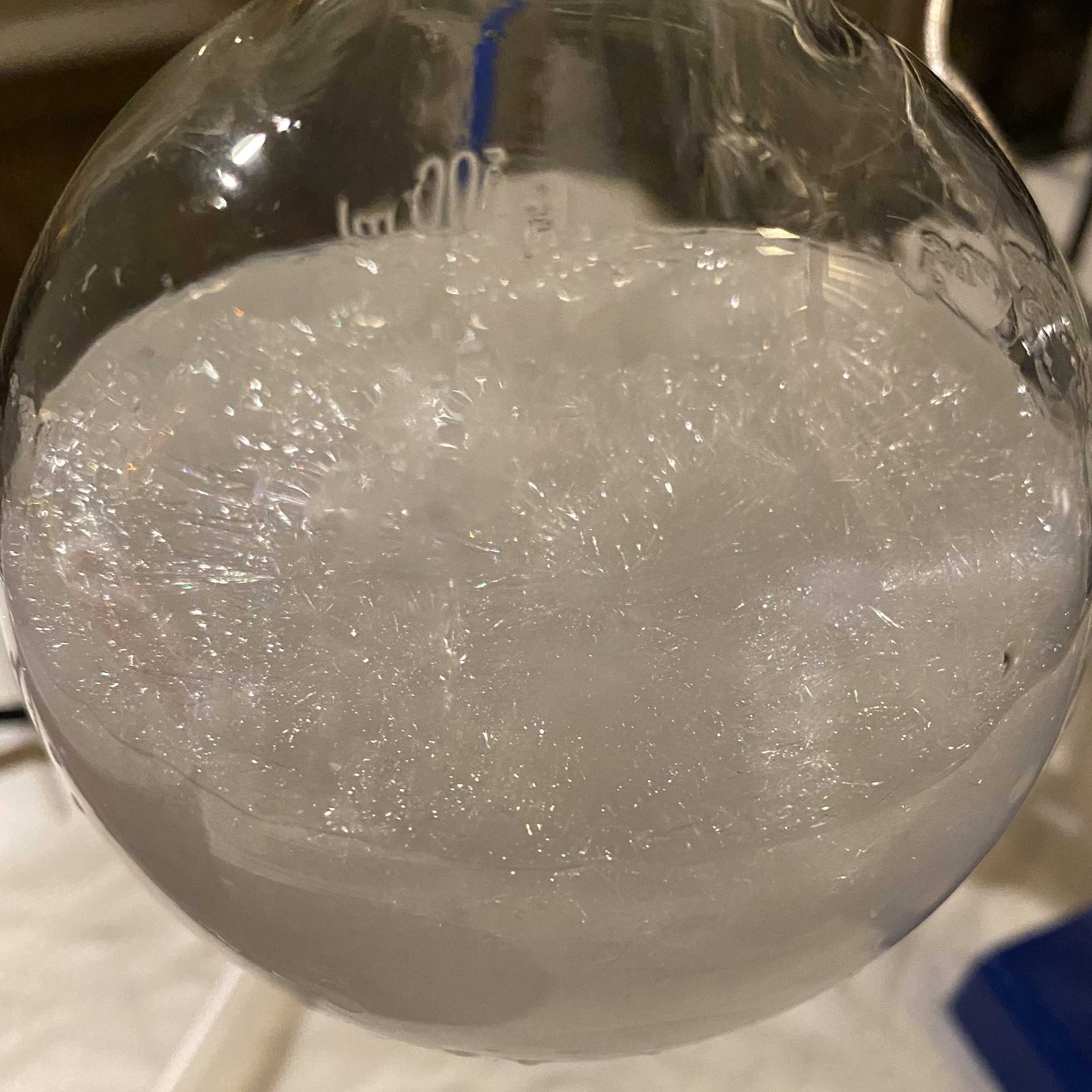 Crystalline solution in round bottom flask